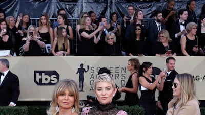 Mother-and-daughter duo Goldie Hawn and Kate Hudson wore Kate Spade and Valentino respectively. We love the hearts on Hudson's pink Valentino. Mike Nelson / EPA