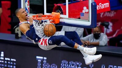 Washington Wizards' Russell Westbrook reacts as he dunks against the Philadelphia 76ers. AP