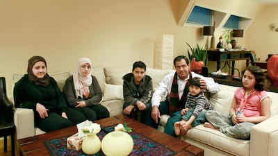 The Abuelaish family, pictured in Toronto in 2009. From left, Shatha, 18, Dalal, 20, Mohammad, 14, Izzeldin, 54, Abdullah, 7, and Raffah, 10 Philip Cheung / The National