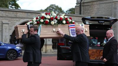The coffin of British football legend Jack Charlton is carried into the West Road Crematorium. AFP