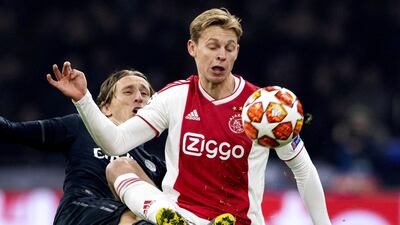 Ajax's Frenkie de Jong is challenged by Real Madrid's Luka Modric. EPA