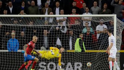 Czech Republic's Zdenek Ondrasek, left, scores his side's second goal during the Euro 2020 group A qualifying soccer match between Czech Republic and England at the Sinobo stadium in Prague, Czech Republic. AP Photo