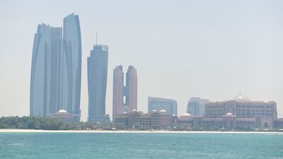 Abu Dhabi-based IHC's new holding company is 'committed to having a transformative impact globally'. Khushnum Bhandari / The National