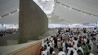 Pilgrims cast stones. AP