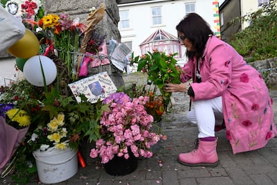A fan places flowers outside Montebello, the house in Bray where Sinead O'Connor lived for 15 years. EPA