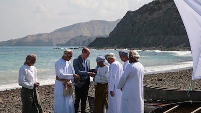 Britain's Prince William shakes hands with a fisherman during a visit to Muscat, Oman. Reuters