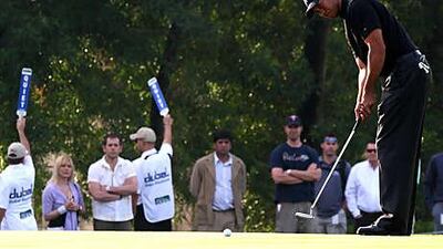 Tiger Woods, seen here at the 2008 Dubai Desert Classic, a tournament which he won, has confirmed he will return to the emirate next year to try and win the event for a third time.