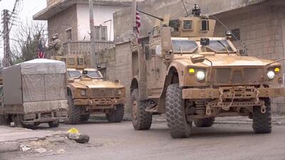 US armoured vehicles at the scene of a suicide attack in Manbij. AFP