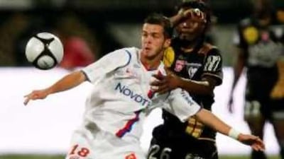 Olympique Lyon's Miralem Pjanic challenges Joel Nguemo during their French League One match last Saturday at the Gerland stadium.