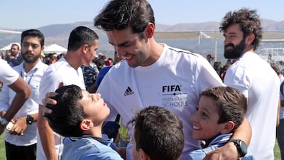 Kaka chats with school pupils. AFP