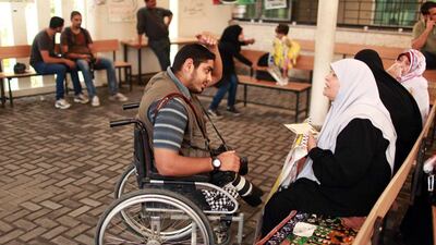 Moamen Qreiqea speaks with protesters calling for the release of Palestinian prisoners from Israeli jails.