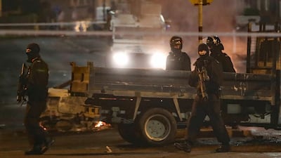 Police guard a crime scene during unrest in the Creggan area of Londonderry, in Northern Ireland. AP