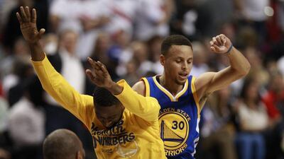 Golden State Warriors guard Stephen Curry (R) celebrates with a teammate during the overtime period of Game 4 of the NBA Western Conference semi-finals basketball game between the Golden State Warriors and the Portland Trail Blazers at the Moda Center in Portland, Oregon USA, 09 May 2016. Steve DiPaola / EPA