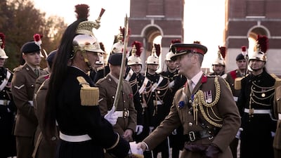 A member of the British Royal Fusiliers and a French Republican guard shake hands after a remembrance ceremony at the Thiepval Memorial in northern France. EPA