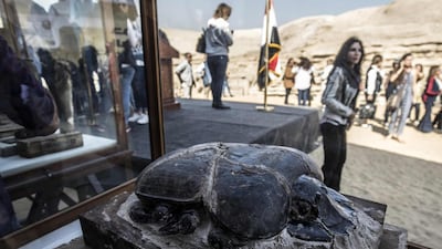 The statue of a scarab is displayed after the announcement of a new discovery carried out by an Egyptian archaeological team in Giza's Saqqara necropolis, south of the capital Cairo. AFP