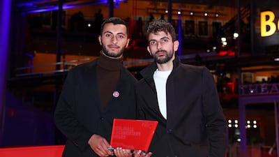 Basel Adra, left, and Yuval Abraham with the Berlinale documentary award for the movie No Other Land. Getty Images