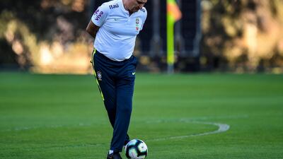 Tite, the Brazil manager, dribbles with the ball. AFP