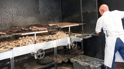 A grill master at work at a seafood restaurant in Getaria, the seaside village known for its excellent turbot, fresh fish and shellfish.
