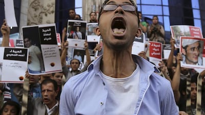 Members of the April 6 movement shout slogans with activists against the government as they protest against the detention of several members of their movement in front of the Press Syndicate building in Cairo. Mohamed Abd El Ghany / Reuters