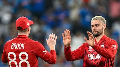 England's Will Jacks celebrates with captain Harry Brook after taking the wicket of India batter Sanju Samson. AFP