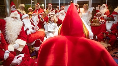 Members of the Berlin Santa Claus Headquarters attend a Santa Claus assembly at the Friedrichsfelde Palace in Berlin, Germany. EPA