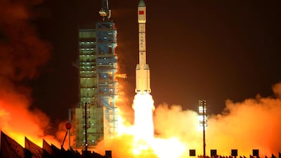 China's Long March 2F rocket carrying the Tiangong-1 module blasting off from the Jiuquan launch centre in Gansu province in 2011. The country is determined to catch up with the US and Russia. AFP