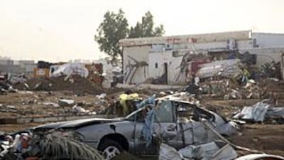 A damaged car is seen in Jeddah after floods churned through the Saudi port city on the Red Sea 10 days ago, killing at least 123 people.
