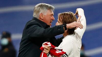 Carlo Ancelotti hugs Luka Modric after the match. Reuters