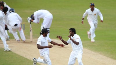 Shaminda Eranga of Sri Lanka, right, celebrates with Nuwan Pradeep after taking the final wicket on Tuesday to win the second Test against England. Dave Thompson / Getty Images / June 24, 2014