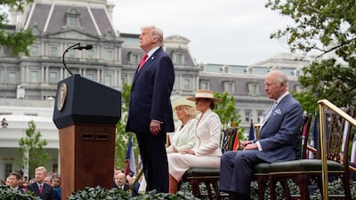 Mr Trump stands at the podium during the arrival ceremony. Bloomberg