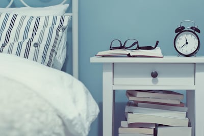 Replace screens with books, and smartphones with old-fashioned alarm clocks in the bedroom. Getty