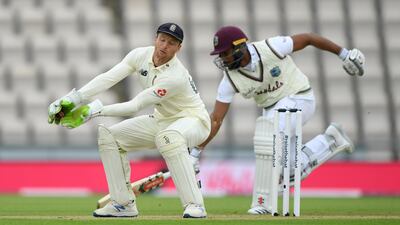 England wicketkeeper Jos Buttler takes the ball as Kraigg Brathwaite of the West Indies makes his ground. Getty
