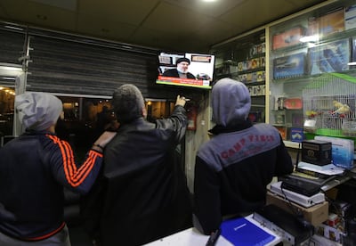 Lebanese men in a Beirut shop listen to Hezbollah leader Hassan Nasrallah during his TV interview on Al Mayadeen channel on January 26, 2019. EPA