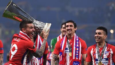Lucas Hernandez of Atletico Madrid celebrates with the trophy following the UEFA Europa League Final between Olympique de Marseille and Club Atletico de Madrid at Stade de Lyon in Lyon, France, on May 16, 2018. Laurence Griffiths / Getty Images
