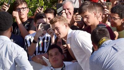 Juventus new signing Matthijs de Ligt greets supporters in Turin. EPA