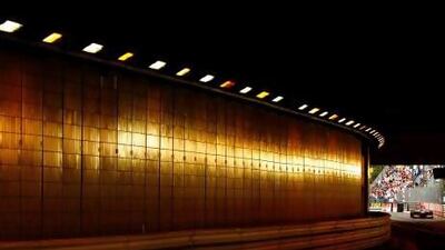 Jenson Button's McLaren-Mercedes enters the Monte Carlo tunnel on the Circuit de Monaco amid a cacophony of noise during the practice session yesterday. Paul Gilham / Getty Images