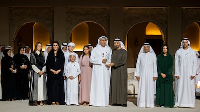 ABU DHABI, UNITED ARAB EMIRATES - November 13, 2025: HH Sheikh Mohamed bin Zayed Al Nahyan, President of the United Arab Emirates (4th R) presents an Abu Dhabi Award to HE Khaldoon Khalifa Al Mubarak, Abu Dhabi Executive Council Member Chairman of the Executive Affairs Authority and Managing Director Group CEO of Mubadala Investment Company (5th R), during the Abu Dhabi awards ceremony, at Qasr Al Hosn. seen with HE Mohamed Khalifa Al Mubarak, Abu Dhabi Executive Council Member and Chairman of the Abu Dhabi Department of Culture and Tourism (R), HE Razan Khalifa Al Mubarak, Managing Director of the Environment Agency – Abu Dhabi (2nd R) and other family members. ( Abdulla Al Neyadi / UAE Presidential Court ) ---