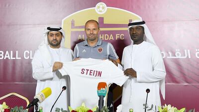 From left: Ahmed Al Rumaithi, chairman of Al Wahda’s board of directors, Maurice Steijn, the club's new first-team manager, and Abdulsalaam Juma, team manager, during Steijn's presentation ceremony in Abu Dhabi on Monday. Courtesy Al Wahda
