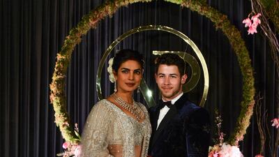 Newlyweds Priyanka Chopra, 36, and Nick Jonas, 26, pose for a photograph during a reception at a hotel in New Delhi on December 4, 2018. Photo: AFP