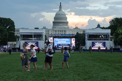 Visitors leave the Great American State Fair during the "Salute to America 250" Fourth of July celebrations on the National Mall after officials instructed everyone to evacuate the area due to severe weather. Getty Images via AFP