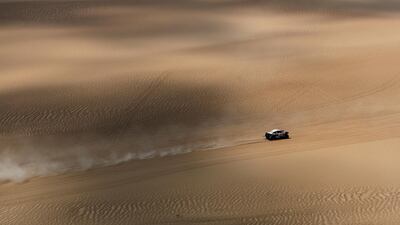 Srt Racing no. 356 BUGGY LCR30 car driven by Michael Pisano and Valentin Sarreaud races on the sand dunes. Getty Images
