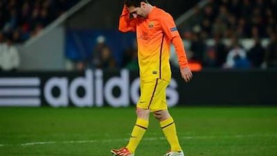 Barcelona's Lionel Messi walks off the pitch after he suffered a hamstring injury against PSG on Tuesday. Frank Fife / AFP
