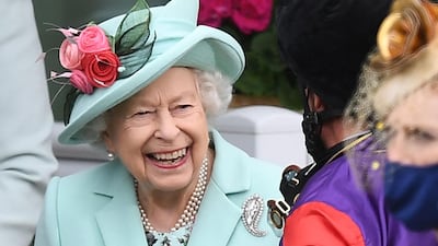 Queen Elizabeth II meets jockey Frankie Dettori on the fifth day of the Royal Ascot horse-racing meet. AFP