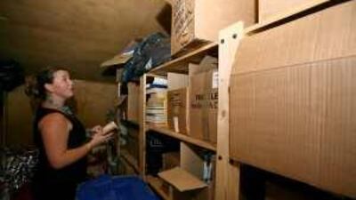 Alexi Trenouth looks over some of the memorabilia from the Queen Elizabeth 2.