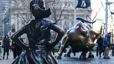 The fearless girl is a symbol of female strength, standing opposite the famous statue of the Wall Street bull. William Volcov/ Brazil Photo Press