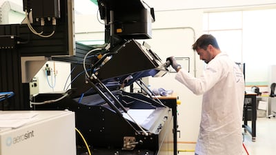 Federico Bosio, lead researcher in additive manufacturing materials, works inside the 3D-printing lab at the Technology Innovation Institute in Abu Dhabi. All photos: Pawan Singh / The National