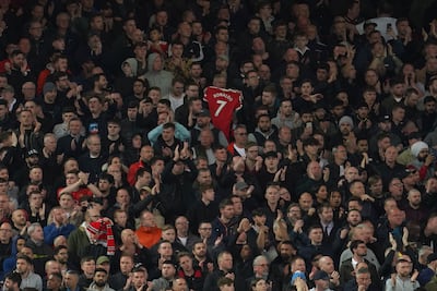 Liverpool fans applaud on the seventh minute in support for Manchester United's Cristiano Ronaldo and his family during the English Premier League soccer match between Liverpool and Manchester United at Anfield stadium in Liverpool, England, Tuesday, April 19, 2022. (AP Photo / Jon Super)
