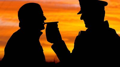 A motorist is stopped by police to undergo a breath test as part of continuing road safety enforcement in the UK. PA