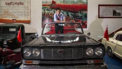 Luo Wenyou stands in a Hongqi, or Red Flag car; limousines that were custom-built for the Chinese leadership and used by visiting dignitaries at his museum for classic cars in Beijing. James Wasserman for The National