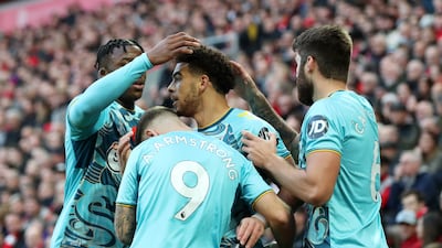 Che Adams of Southampton celebrates with teammates after scoring. Getty